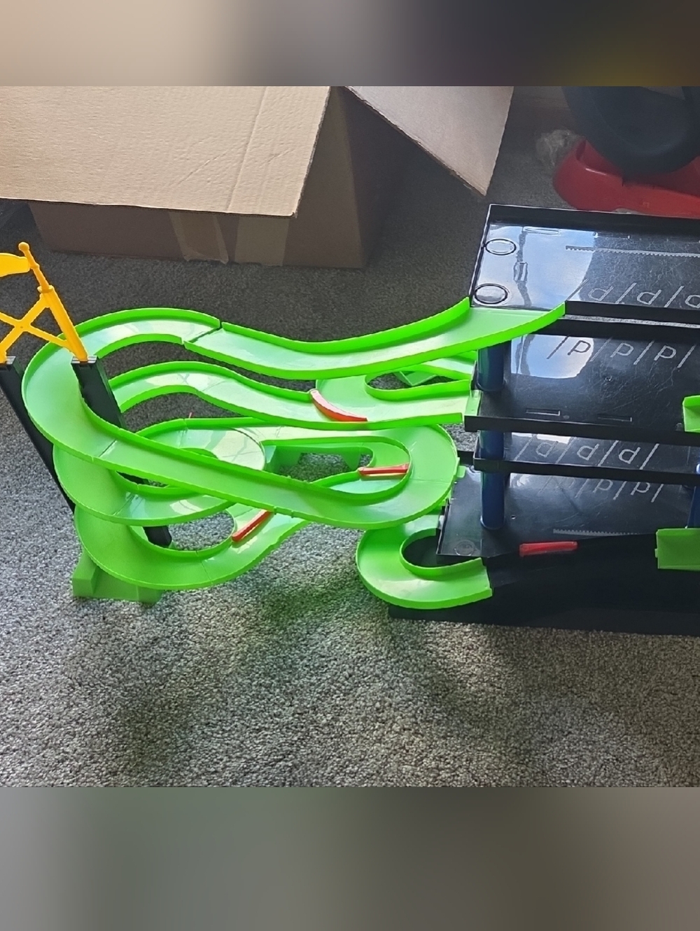 Green Spiral Toy Race Track with Yellow Helicopter Pad